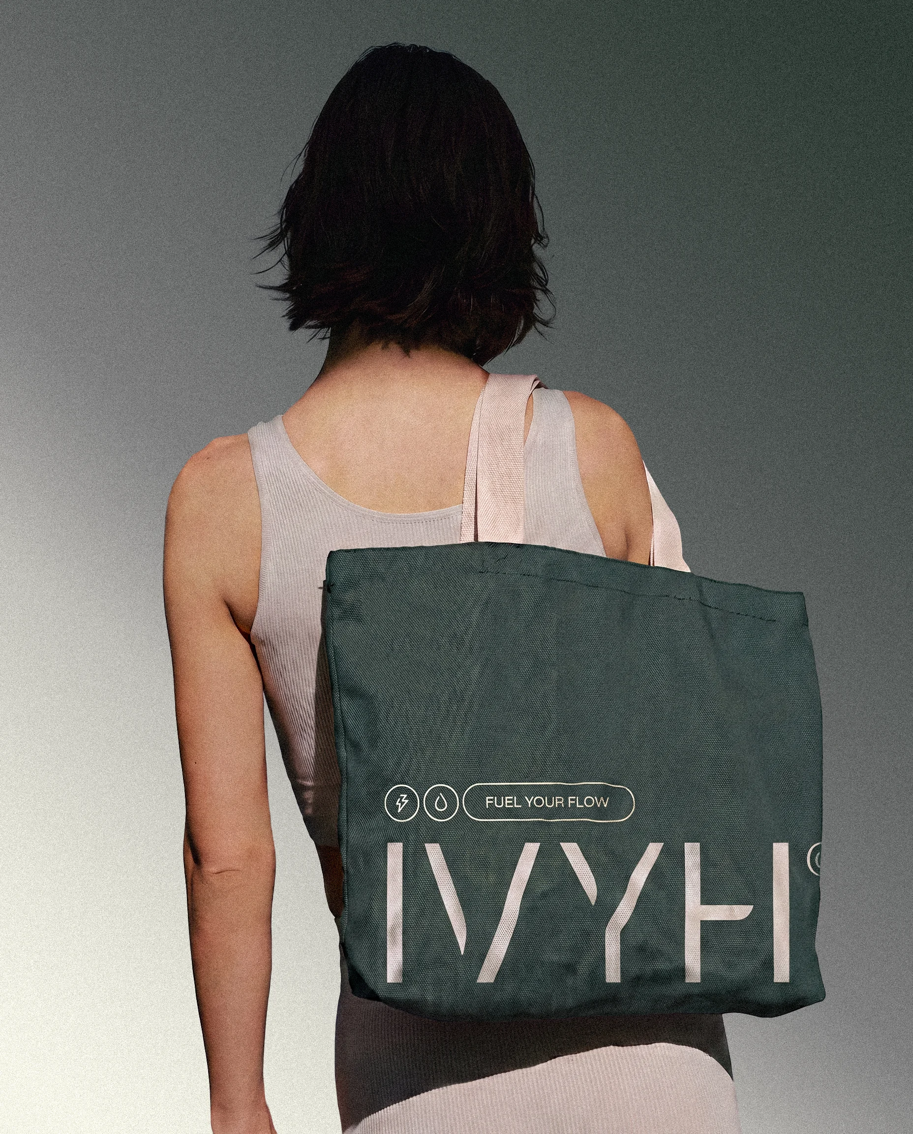 Person wearing an IVYH branded tote bag